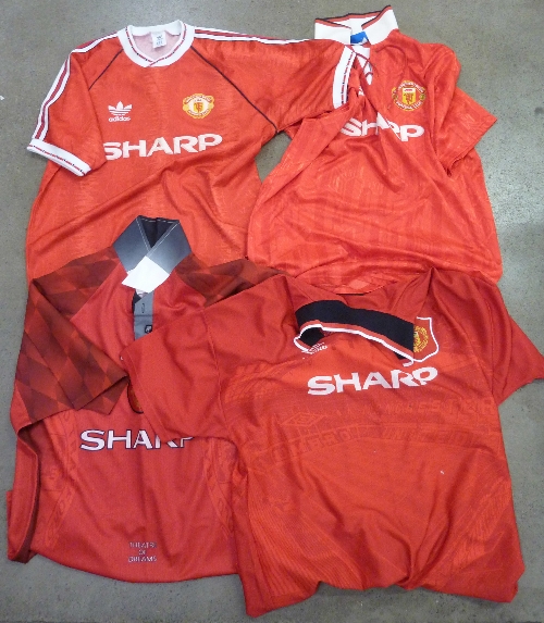Four Manchester United home football shirts, one away shirt, scarves, hats,