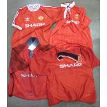 Four Manchester United home football shirts, one away shirt, scarves, hats,