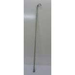 A glass walking cane and a wood walking stick