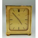 An 8 day Imhof brass clock, height 10.