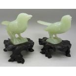 A pair of 20th Century jade birds on stand