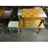 A pair of cast metal table bases and a set of steps,