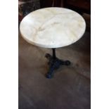 A cast iron based circular pub table