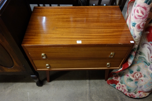 A teak chest of two drawers