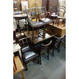 An oak draw-leaf table and six chairs