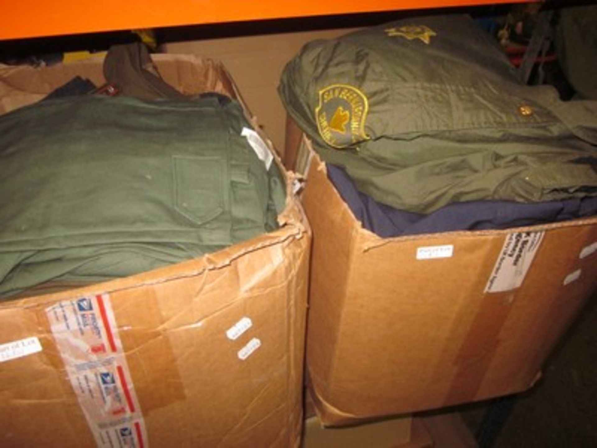 Nine boxes of US Army and Navy military surplus including combat jackets, trousers, caps and t- - Image 3 of 4