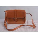 A Brown Leather Gucci Handbag.  New tan