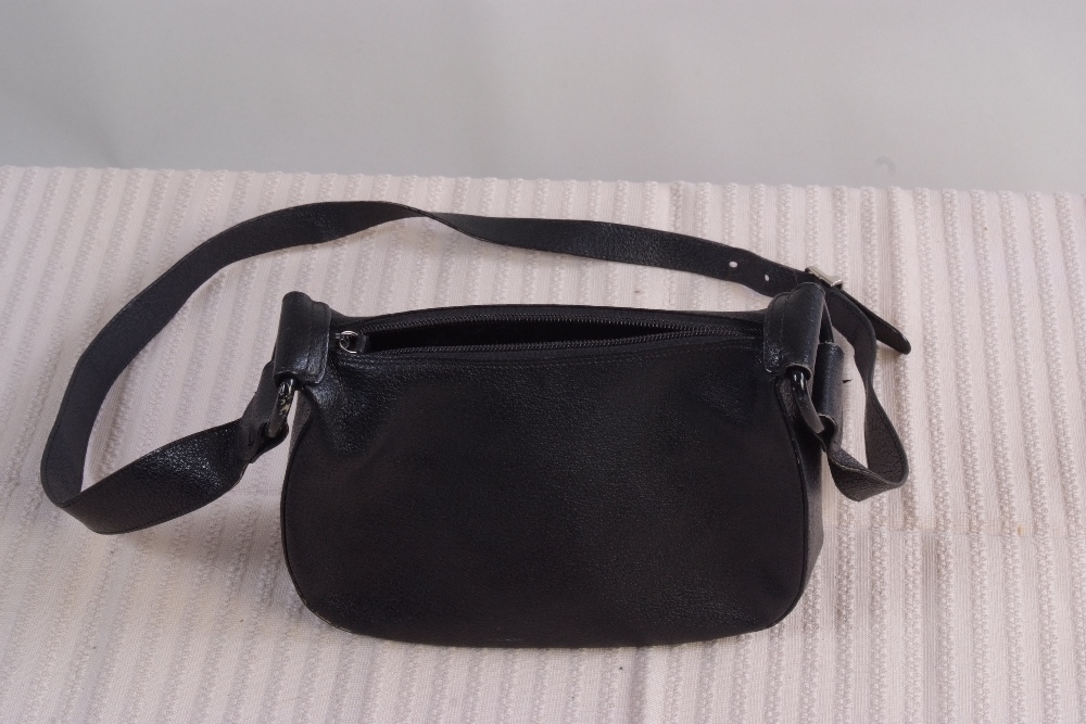 A Black Leather Shoulder Bag.  A zip acr
