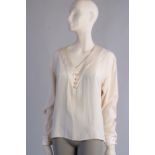 A 'Chanel Boutique' cream silk Blouse. A