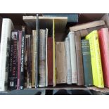 A tray of various books, including The M