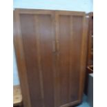 A 1930's pine wardrobe with wall mirror