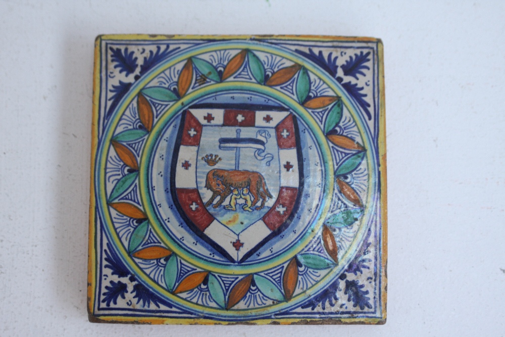 A majolica tile hand painted with herald