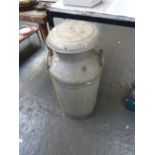 A vintage aluminium milk churn, with a s