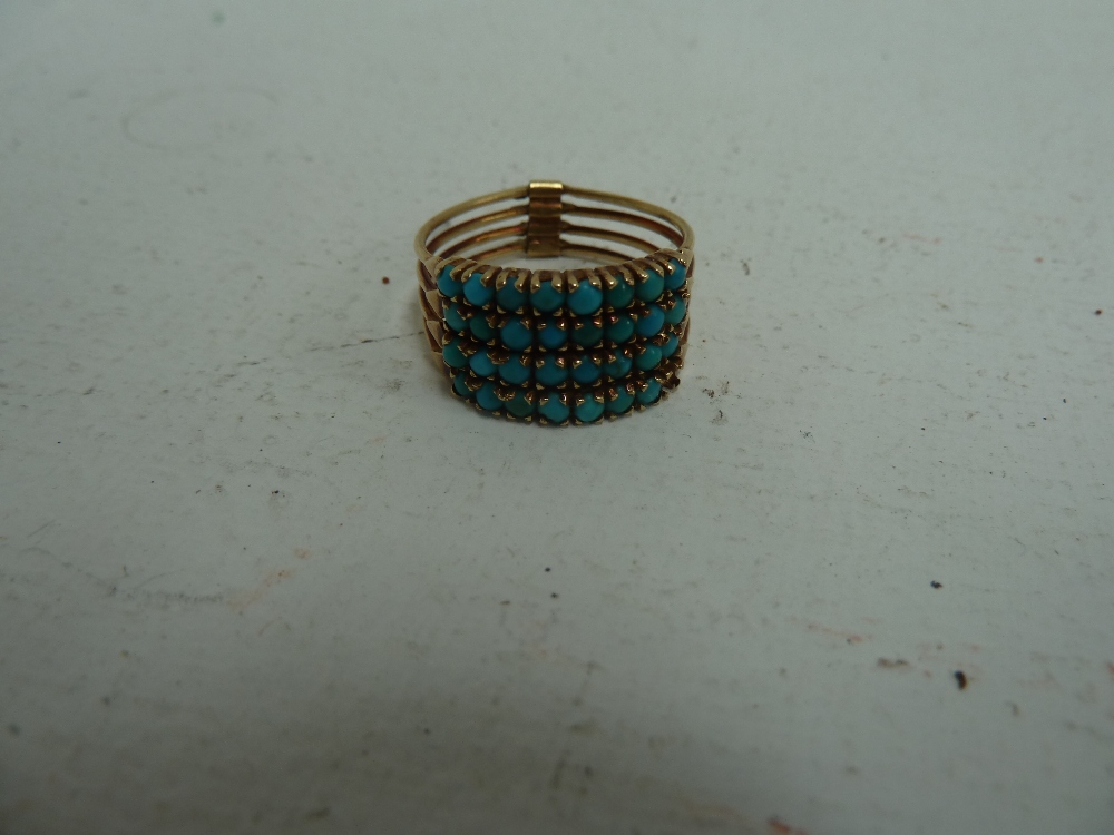 A 19th century Turkish gold and turquoise Harem four band ring, size R/S