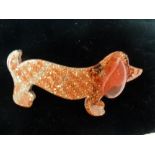 A Lea Stein hair clip in the form of Dachshund