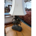 A spelter table lamp in the form of an ancient warrior on horseback,