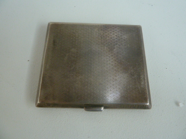 An Art Deco silver cigarette case, by Atkin Bros Ltd, Birmingham 1926, 3.