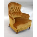 A Victorian gentleman's chair, upholstered in gold material,