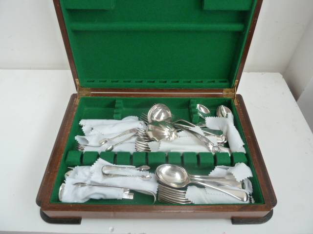 A part canteen of silver plated flatware, including shell pattern ladle, sugar tongs,