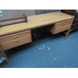A 20th century kneehole desk, long rectangular top over four drawers,