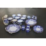 A Staffordshire blue floral decoration over cream ground heightened with gilt part tea set to