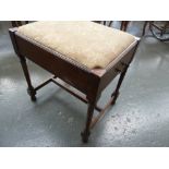 An early 20th century elm music stool, with turned supports, stretcher,