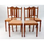 A set of four handmade Edwardian mahogany and satinwood banded slat back dining chairs,