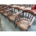 A set of six 19th century elm spindle back captains chairs