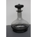 A Wedgwood glass smoke grey glass admirals decanter designed by Frank Thrower,