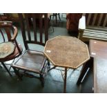 An octagonal bamboo side table, on three splayed legs, with a 19th century oak slat back chair,