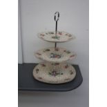 A Midwinter Stylecraft Staffordshire three tier cake stand of floral and gilt design,