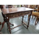 A 17th century style oak side table, rectangular top over carved frieze and drawer,