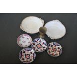 Four china saucers of floral design,