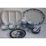 A quantity of china to various blue and white and colourful rice dishes and spoons made in China,