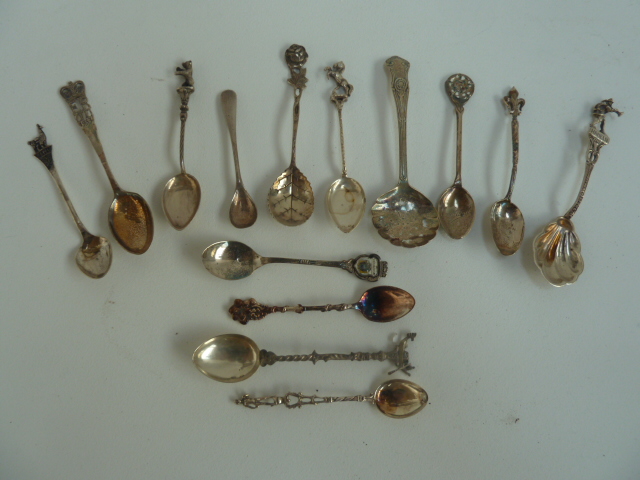 A number of silver (925 and 800) apostle, sifter and tea spoons,