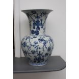 A large oriental blue and white vase, of baluster form,