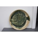 A set of seven handmade stoneware fish plates, impressed 'V.