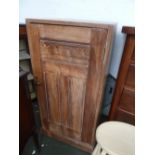 An early 20th century pine cupboard, three internal shelves, turned brass handle, on plinth,