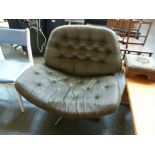 A 20th century design large swivel button back chair,