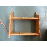 A pine side cabinet, two drawers beside shelf, raised on bracket feet,