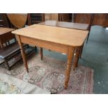 A 19th century pine side table, rectangular top on four turned legs,