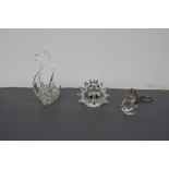 A collection of glass figurines to include a Swarovski crystal hedgehog,