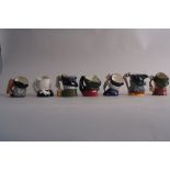 A quantity of Royal Doulton toby character jugs to include Tam o' Shanter, the Lawyer, Merlin,