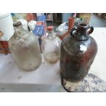 Three vintage cider distillery bottles,