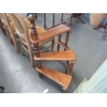 A set of 20th century elm library step with turned supports,