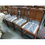 A set of four 20th century oak panel back chairs,