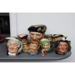 A quantity of early and later Royal Doulton toby jugs of various sizes to include John Barleycorn