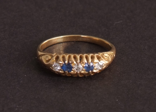 A Victorian gold, diamond and sapphire cushion set four stone engagement ring,