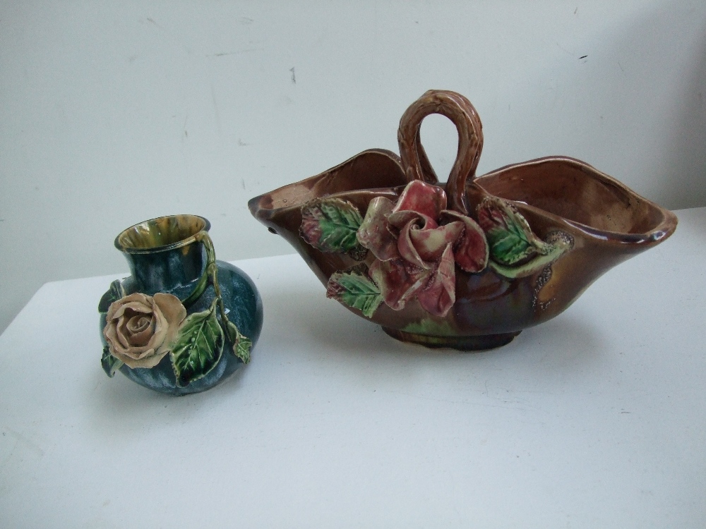 Two colourful glazed poesy vases with applique ceramic roses,