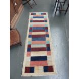 A small Khyber runner rug of striped design,